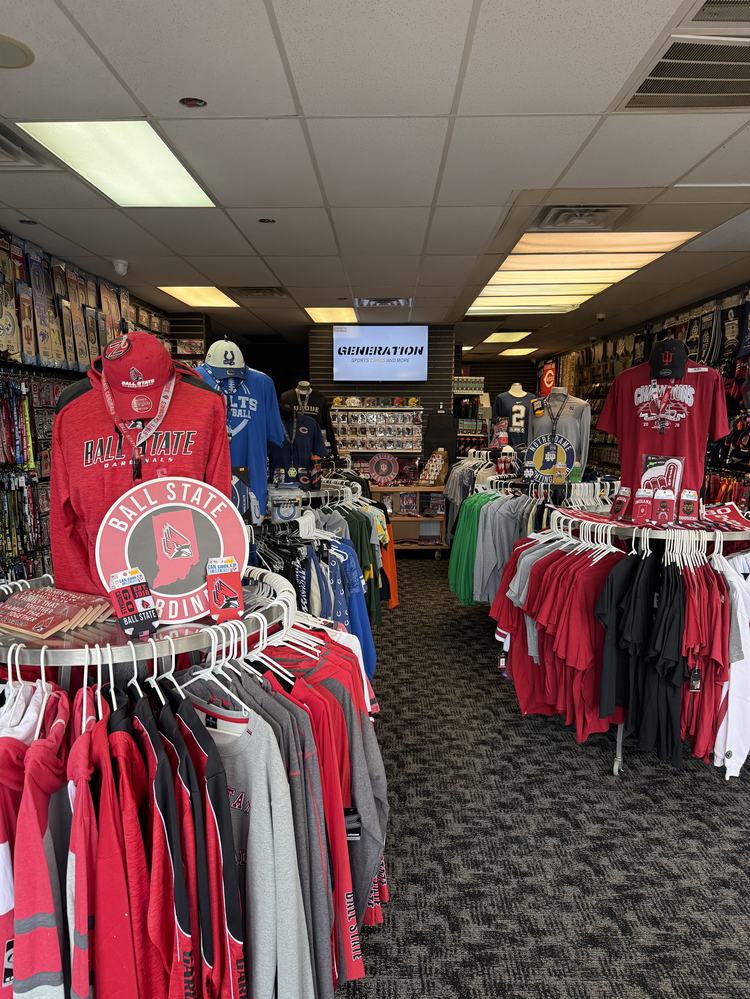 Racks of team hoodies and tees on the sales floor