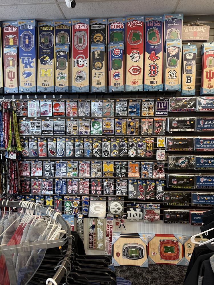 Wall of team decals, stickers and license plate frames