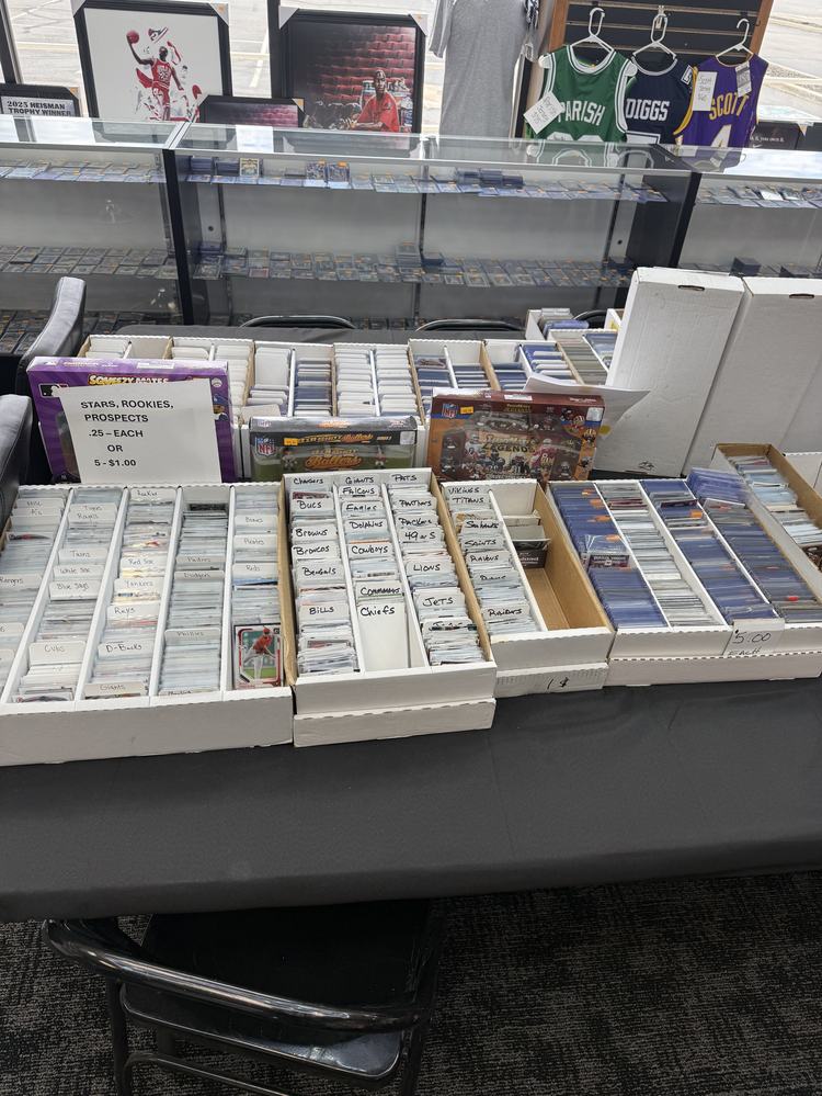 Tables of sorted card boxes labeled by team
