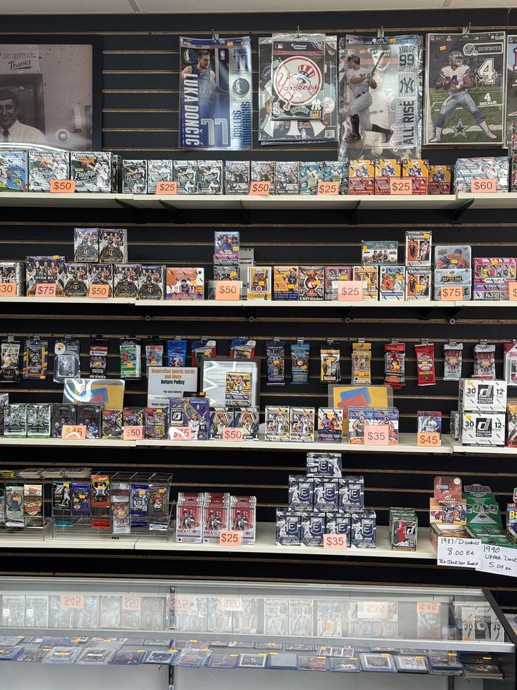 Shelves of sealed hobby boxes, blasters and retail packs with price tags