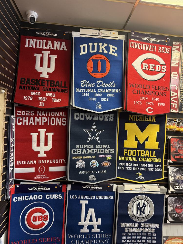 Wool championship banners for Indiana, Duke, the Reds, the Cowboys and Michigan